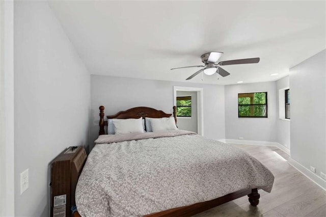 10323 Grassy Mountain Rd, Ellijay, GA 30540 - bedroom featuring light wood finished floors, ceiling fan, and recessed lighting