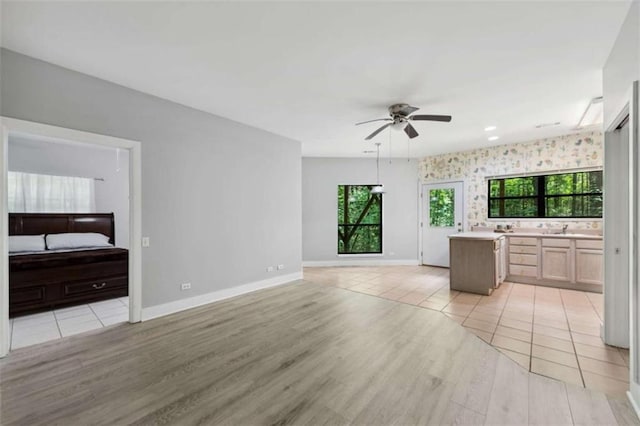 10323 Grassy Mountain Rd, Ellijay, GA 30540 - unfurnished living room with ceiling fan and light wood-style floors