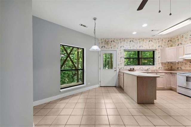 10323 Grassy Mountain Rd, Ellijay, GA 30540 - kitchen with white electric range oven, healthy amount of natural light, under cabinet range hood, light countertops, and recessed lighting