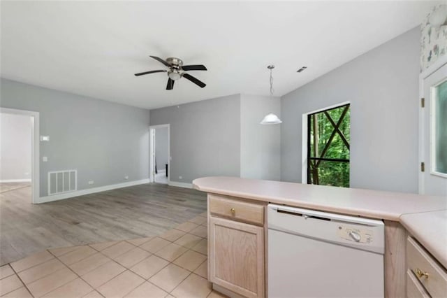 10323 Grassy Mountain Rd, Ellijay, GA 30540 - kitchen featuring white dishwasher, light wood-style floors, light countertops, light brown cabinetry, and open floor plan