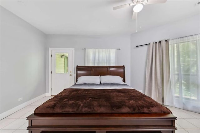 10323 Grassy Mountain Rd, Ellijay, GA 30540 - bedroom with multiple windows, light tile patterned floors, and ceiling fan