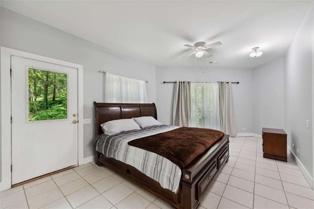 10323 Grassy Mountain Rd, Ellijay, GA 30540 - bedroom with light tile patterned floors and a ceiling fan