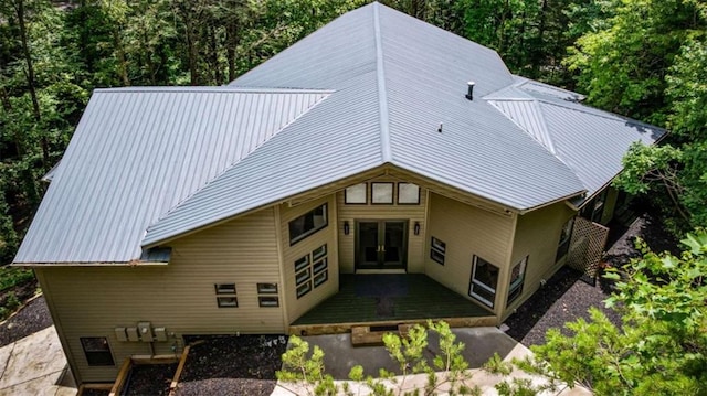10323 Grassy Mountain Rd, Ellijay, GA 30540 - back of property featuring french doors, a metal roof, a forest view, and a wooden deck