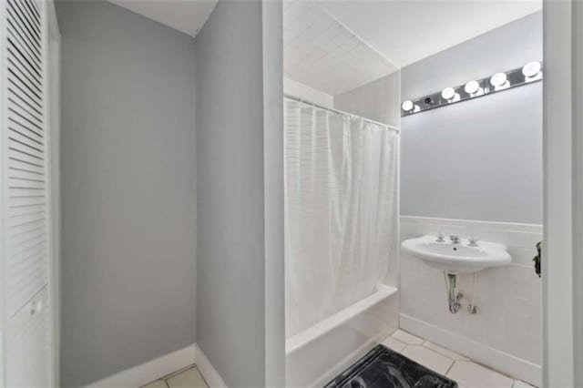 10323 Grassy Mountain Rd, Ellijay, GA 30540 - full bathroom with tile patterned floors and shower / bath combination with curtain