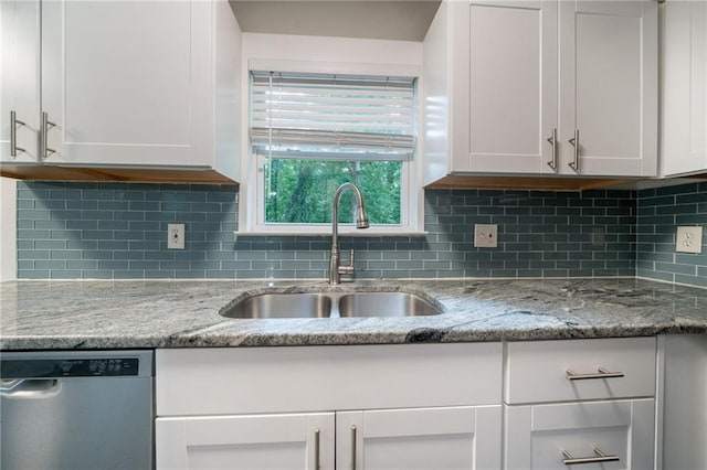 10150 Puckett St, Covington, GA 30014 - kitchen featuring dishwasher, white cabinetry, and backsplash