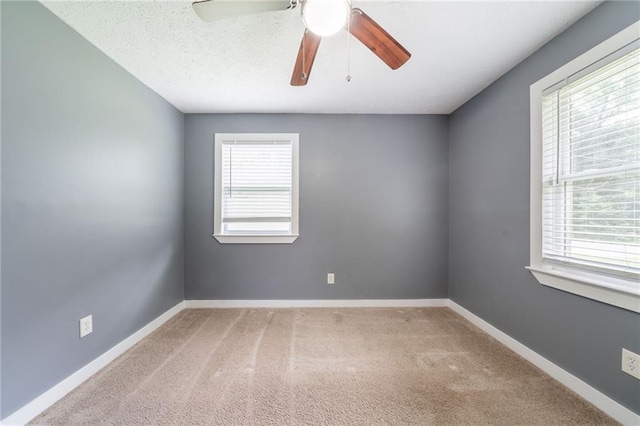 10150 Puckett St, Covington, GA 30014 - carpeted spare room featuring a ceiling fan and baseboards