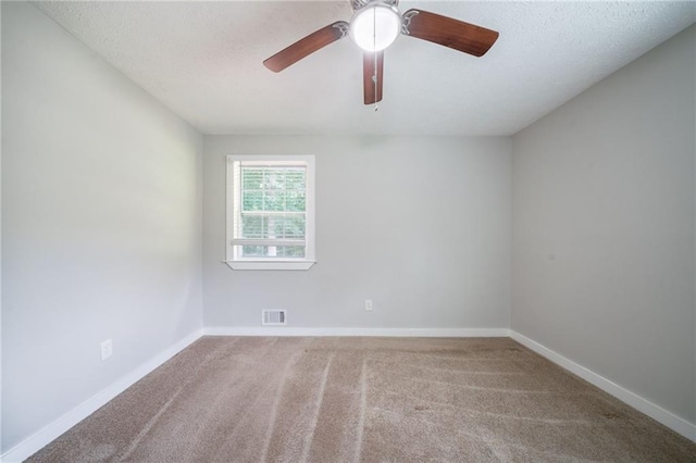 10150 Puckett St, Covington, GA 30014 - spare room featuring carpet floors, ceiling fan, and a textured ceiling