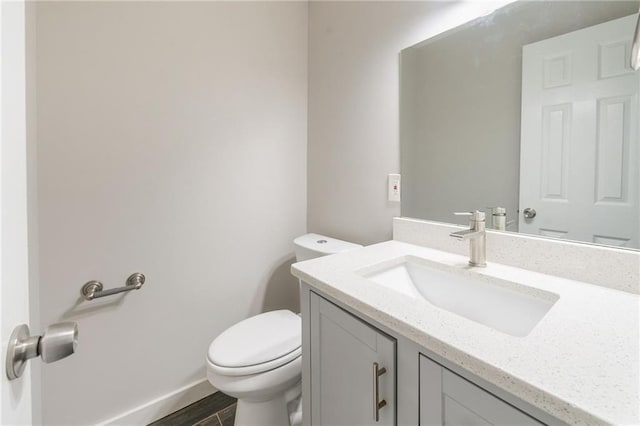10150 Puckett St, Covington, GA 30014 - half bathroom featuring vanity and wood finished floors