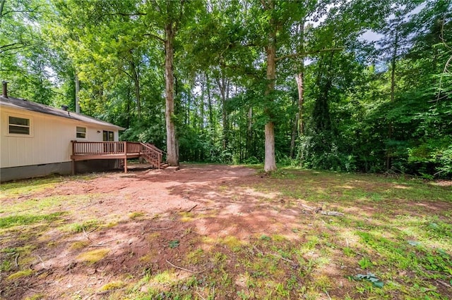10150 Puckett St, Covington, GA 30014 - view of yard featuring a wooden deck