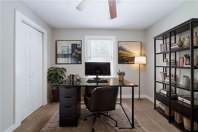 10150 Puckett St, Covington, GA 30014 - carpeted home office featuring a ceiling fan and baseboards