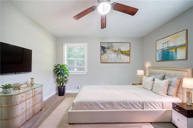 10150 Puckett St, Covington, GA 30014 - carpeted bedroom with baseboards and ceiling fan