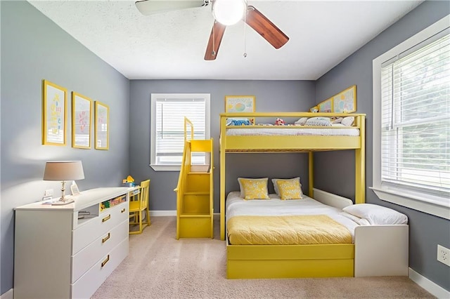 10150 Puckett St, Covington, GA 30014 - bedroom with light colored carpet, multiple windows, and a ceiling fan