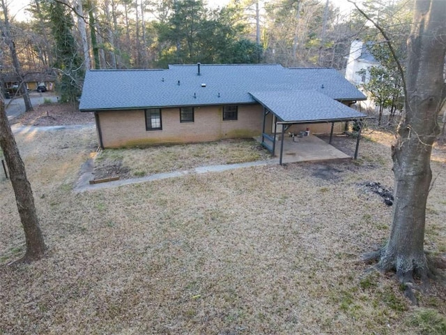 exterior space featuring a shingled roof