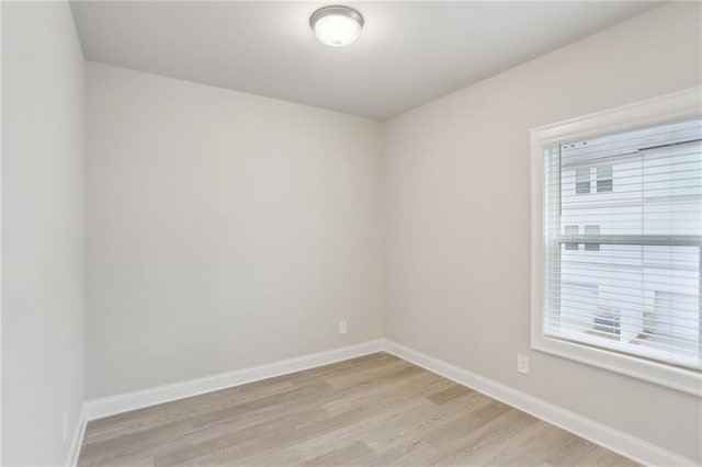 unfurnished room with light hardwood / wood-style flooring