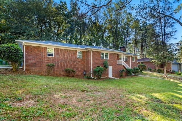 view of property exterior with a yard