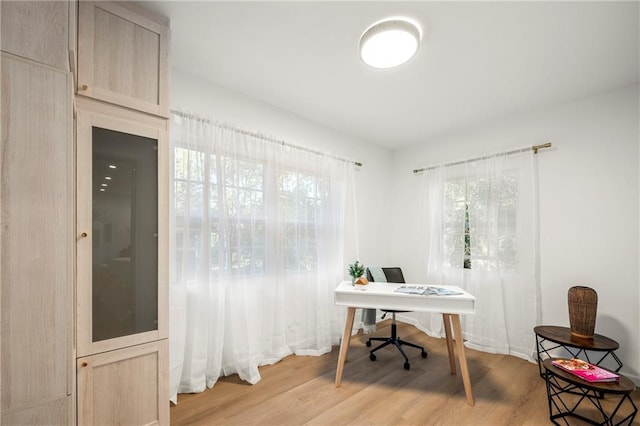 office area with light hardwood / wood-style flooring