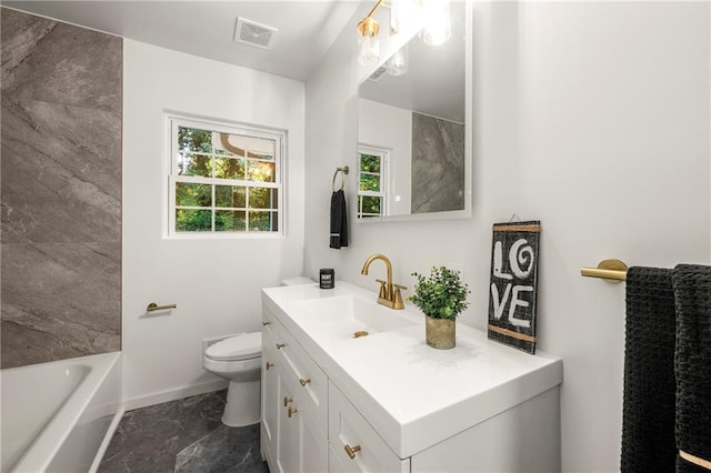 bathroom featuring vanity and toilet