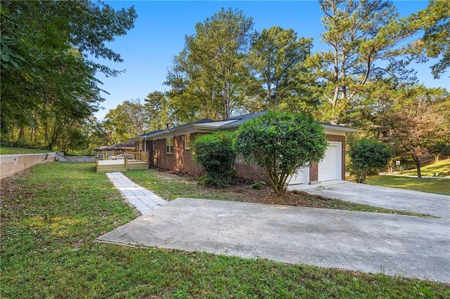 view of property exterior featuring a garage, a deck, and a lawn