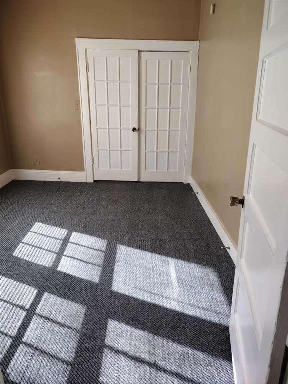 1005 Ashby Ter, Atlanta, GA 30314 - unfurnished bedroom with a closet and carpet