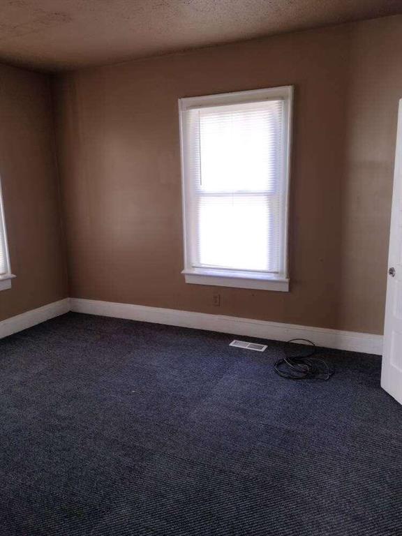 1005 Ashby Ter, Atlanta, GA 30314 - carpeted spare room with a textured ceiling