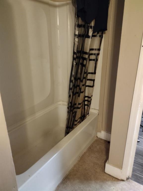 1005 Ashby Ter, Atlanta, GA 30314 - bathroom featuring shower / bath combo with shower curtain
