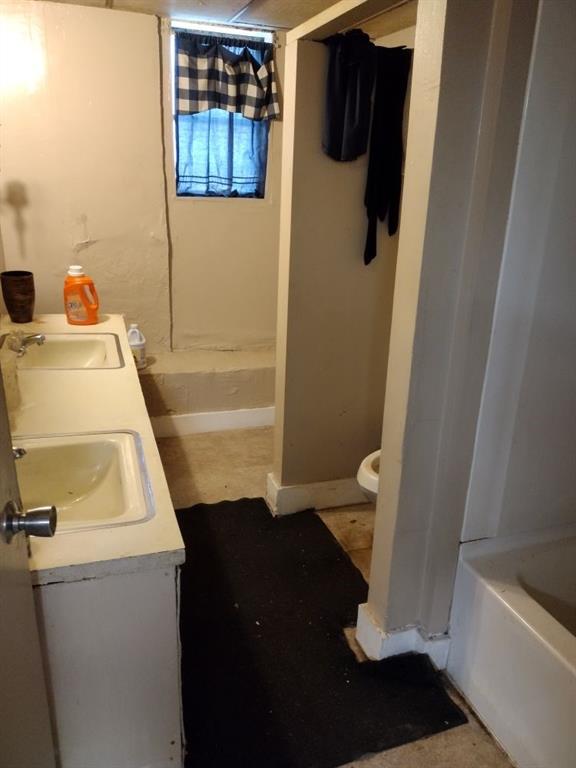 1005 Ashby Ter, Atlanta, GA 30314 - full bathroom featuring vanity, toilet, and separate shower and tub