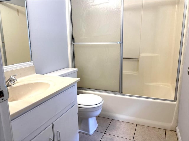 full bathroom with tile patterned flooring, vanity, toilet, and shower / bath combination with glass door