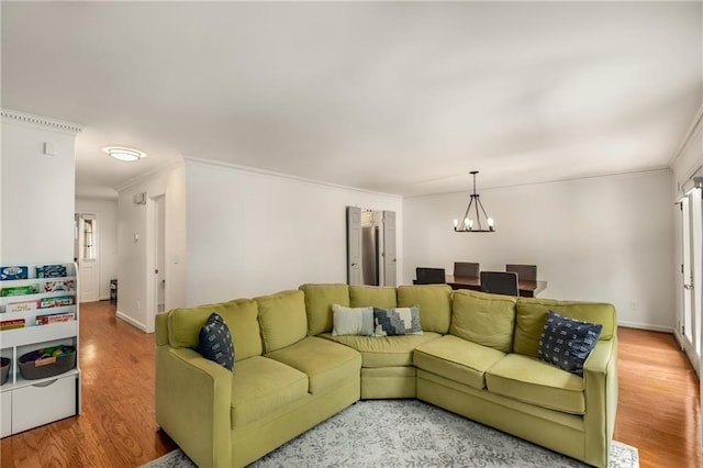 1341 Sheffield Glen Way NE, Atlanta, GA 30329 - living room featuring crown molding, light wood-style floors, a chandelier, and baseboards