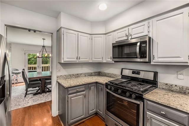 1341 Sheffield Glen Way NE, Atlanta, GA 30329 - kitchen with appliances with stainless steel finishes, gray cabinets, dark wood-type flooring, and light stone countertops