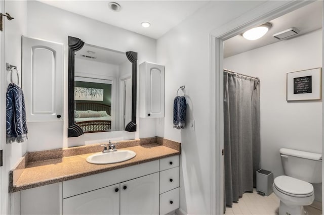 1341 Sheffield Glen Way NE, Atlanta, GA 30329 - ensuite bathroom with toilet, vanity, and tile patterned floors