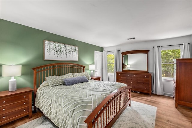 1341 Sheffield Glen Way NE, Atlanta, GA 30329 - bedroom featuring multiple windows and wood finished floors