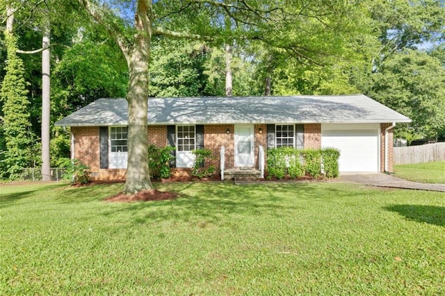 6671 Gano Dr, Riverdale, GA 30274 - ranch-style home featuring an attached garage, brick siding, and driveway