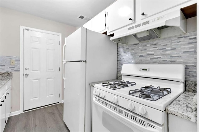 6671 Gano Dr, Riverdale, GA 30274 - kitchen featuring white appliances, under cabinet range hood, wood finished floors, white cabinetry, and backsplash