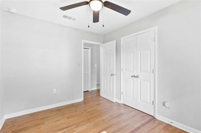 6671 Gano Dr, Riverdale, GA 30274 - unfurnished bedroom featuring light wood finished floors and a ceiling fan