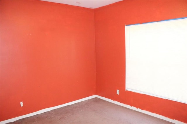 unfurnished room with carpet flooring