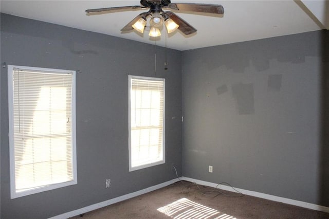 spare room featuring carpet flooring and ceiling fan