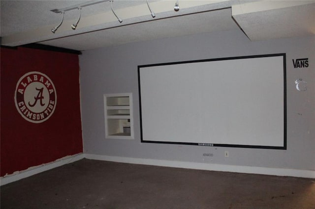 cinema room featuring built in shelves