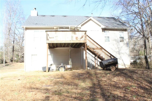 back of house featuring a deck