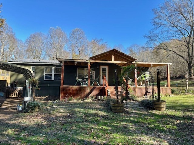 view of front of home featuring a porch and a front yard