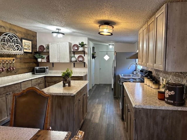 kitchen featuring stainless steel microwave, dark wood-type flooring, light countertops, electric range, and open shelves