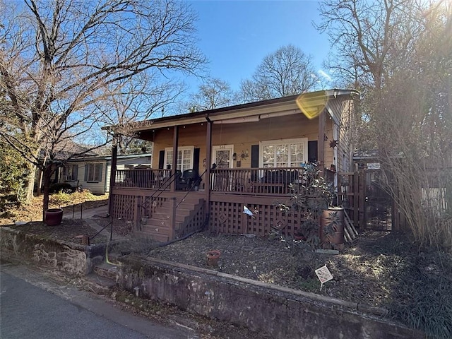 view of front of house with a porch and stairs