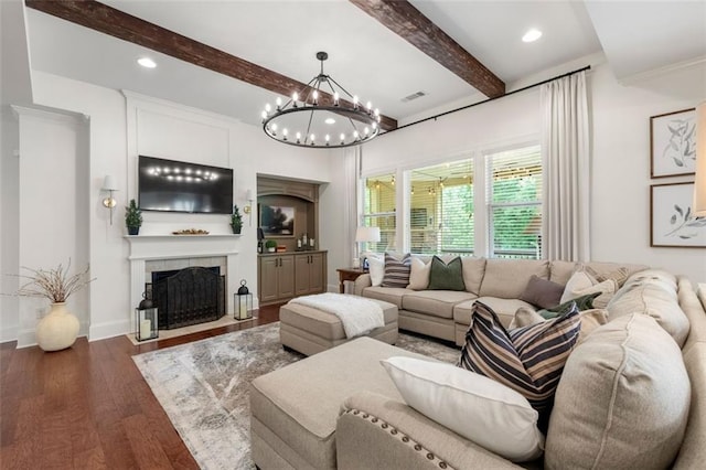 2680 Augeron Ct, Alpharetta, GA 30004 - living room with a tile fireplace, beamed ceiling, wood finished floors, a chandelier, and recessed lighting