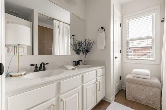 2680 Augeron Ct, Alpharetta, GA 30004 - full bathroom featuring double vanity and tile patterned flooring