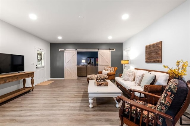 2680 Augeron Ct, Alpharetta, GA 30004 - living area with a barn door, recessed lighting, wood finished floors, and baseboards