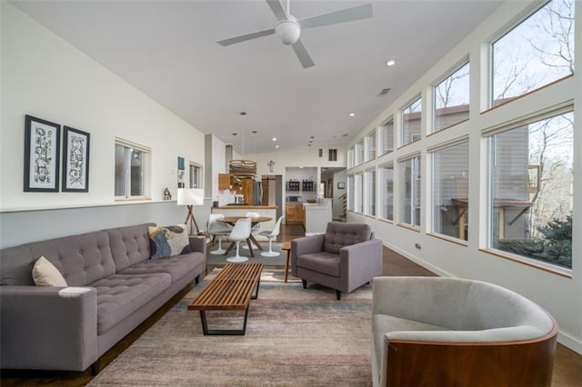 living area featuring baseboards, recessed lighting, and ceiling fan