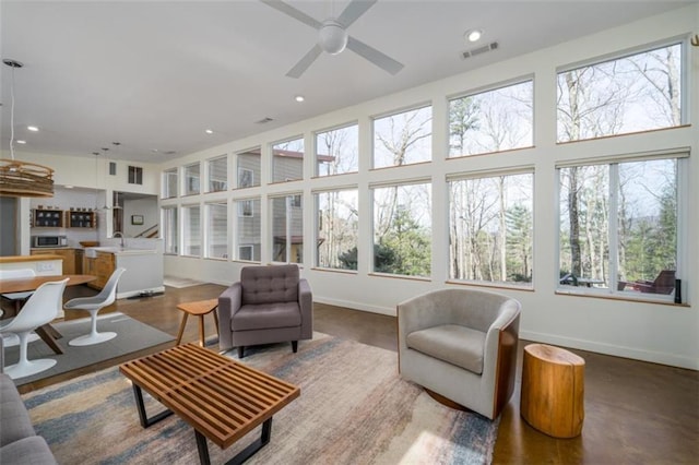 sunroom / solarium with a sink and visible vents