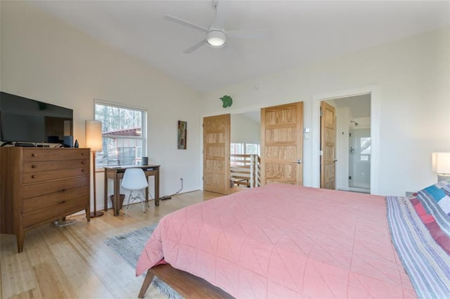 bedroom featuring vaulted ceiling, wood finished floors, and a ceiling fan