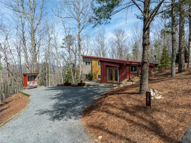 view of front of house with driveway and french doors