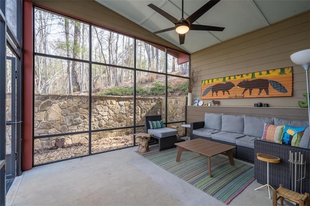 sunroom with an outdoor living space and a ceiling fan