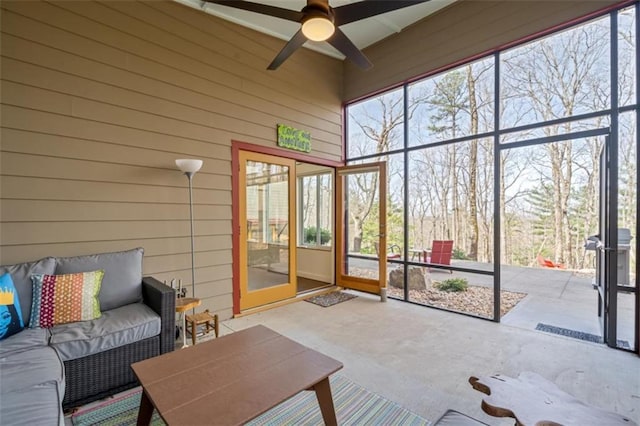 sunroom with an outdoor hangout area and ceiling fan